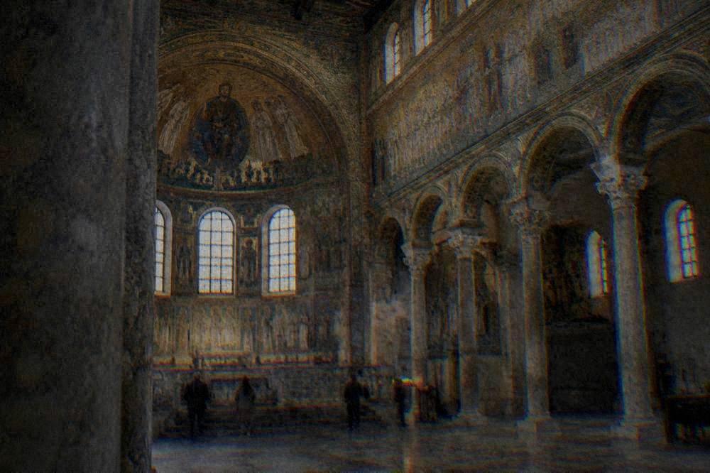 Golden mosaic interior of an early Christian basilica lit through soft daylight