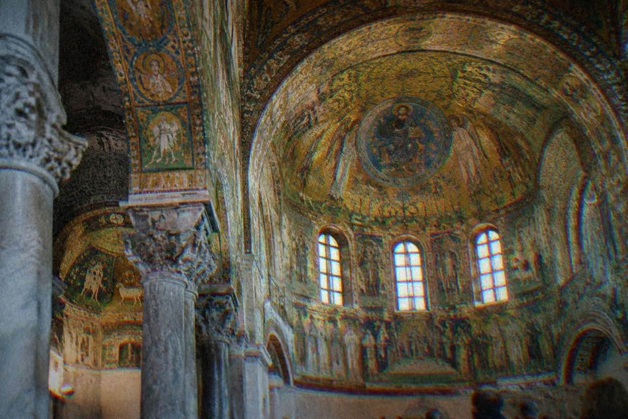 Golden Byzantine mosaics covering the interior of a Ravenna church