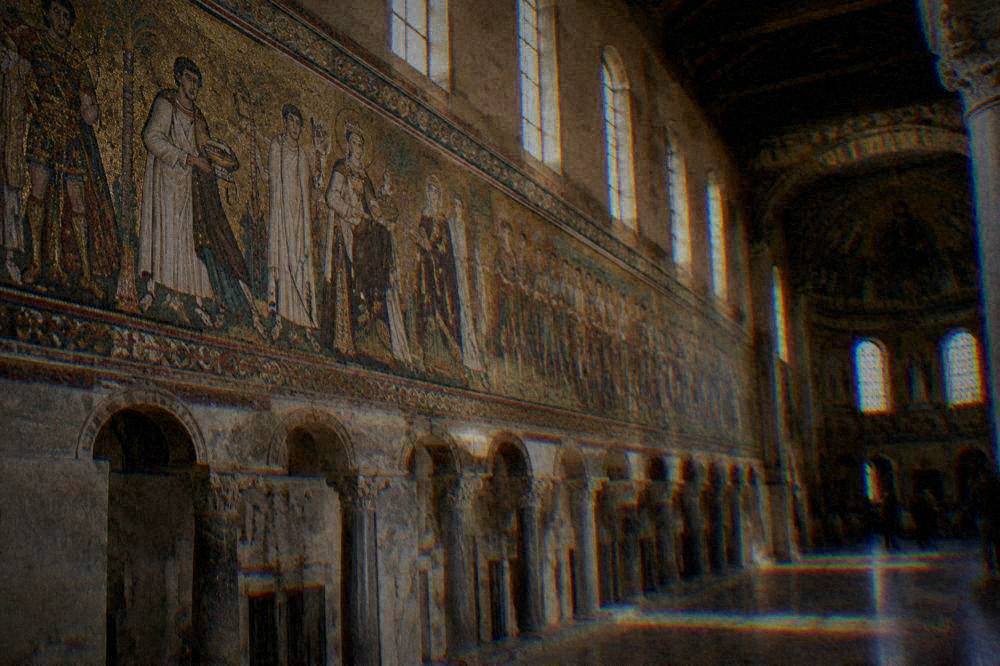 A processional mosaic frieze of figures along the nave wall of a Ravenna basilica