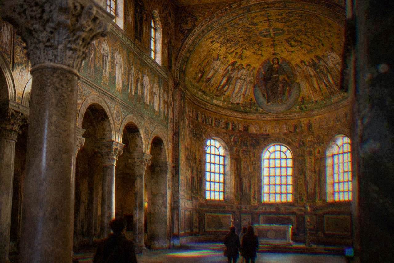 Golden mosaic interior of an early Christian church in Ravenna under soft light