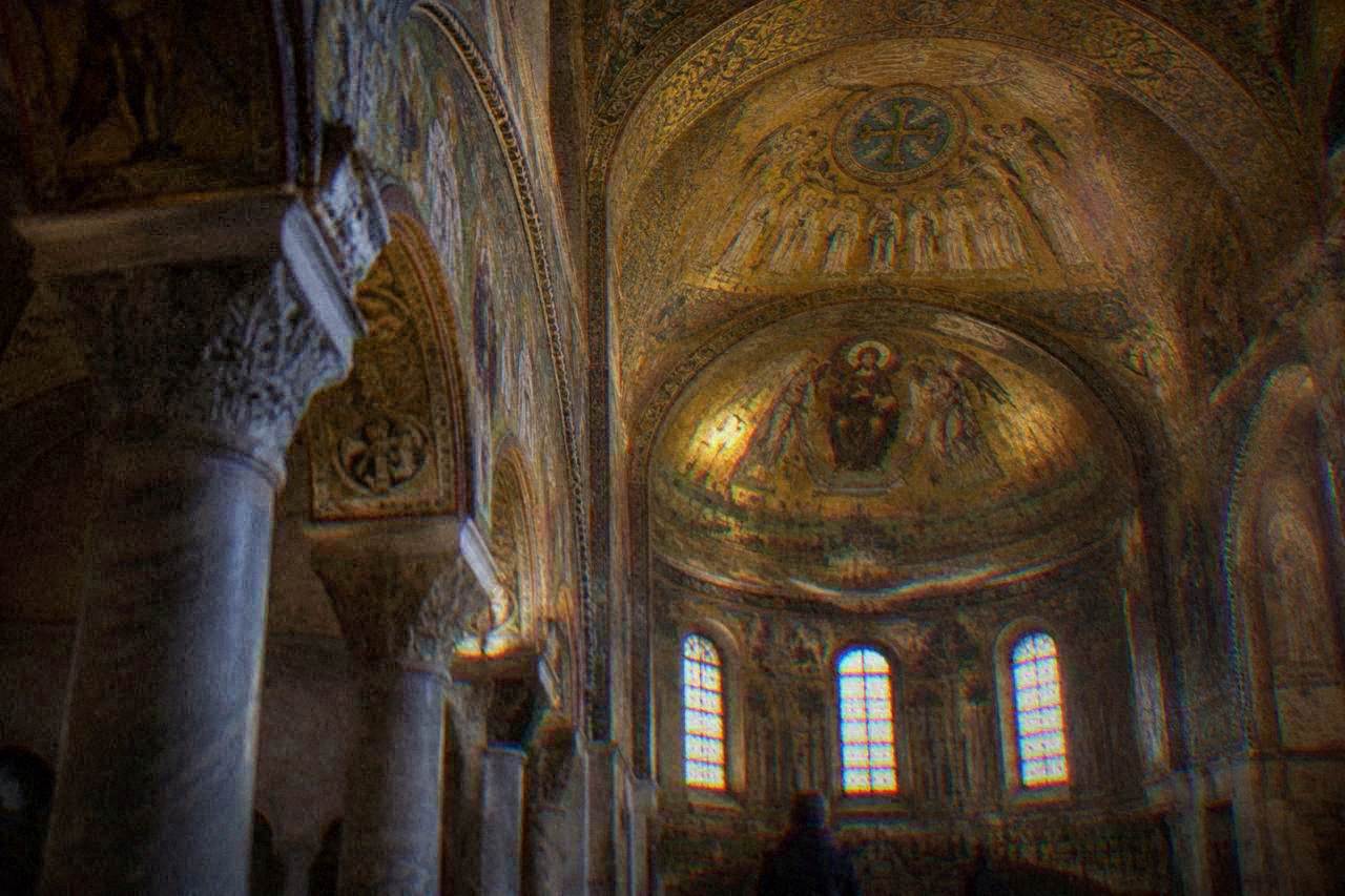 Golden Byzantine mosaics covering the vault of an ancient Ravenna chapel