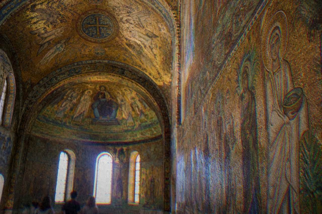 Gold Byzantine mosaics covering the vault and walls of an ancient Ravenna chapel