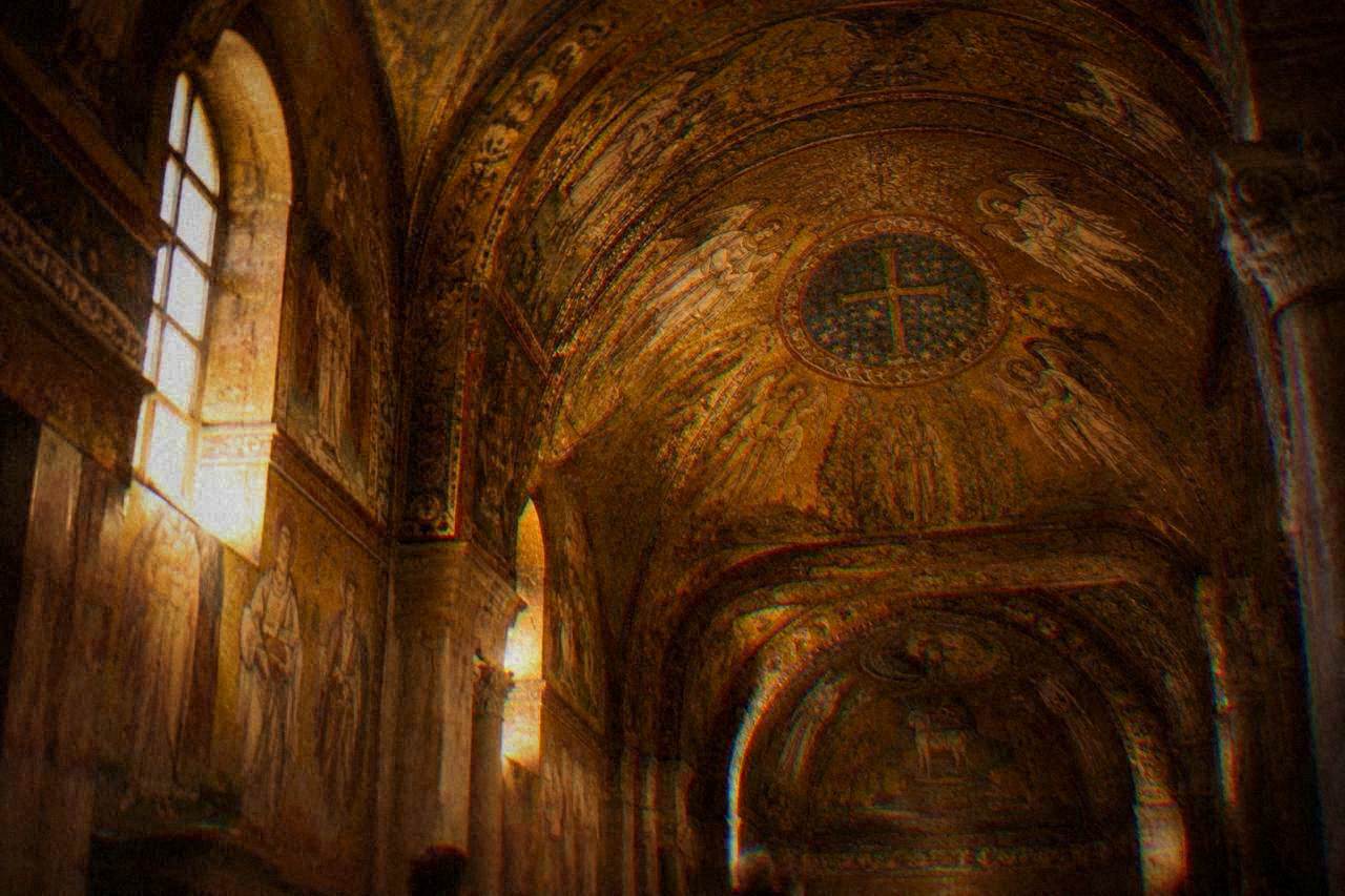 Golden Byzantine mosaics covering the vault of an ancient Ravenna chapel