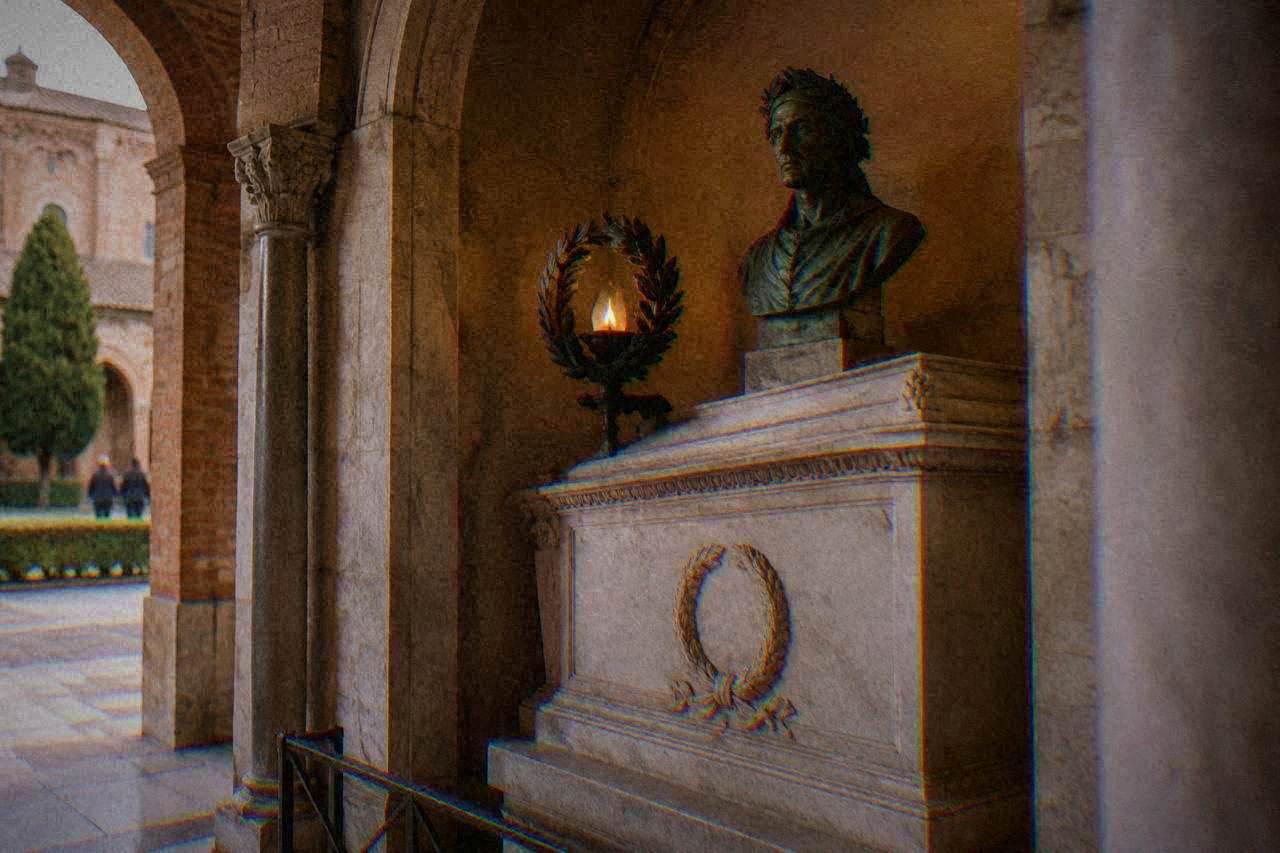 A small marble sarcophagus resting under a vaulted ceiling inside Dante's tomb in Ravenna