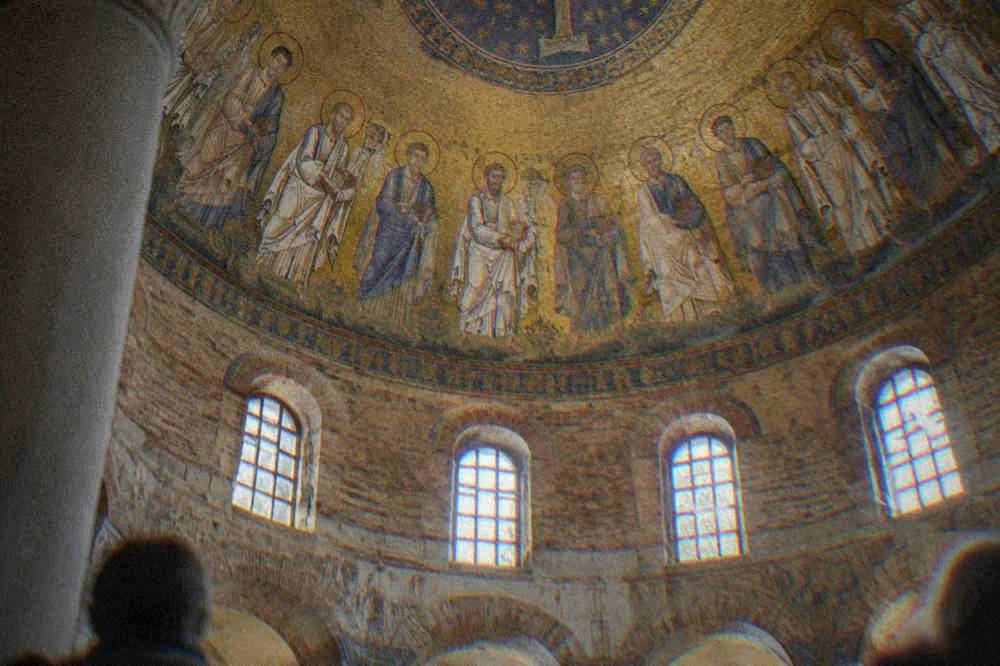 Close view of the mosaic dome showing a procession of apostles in gold and blue tesserae