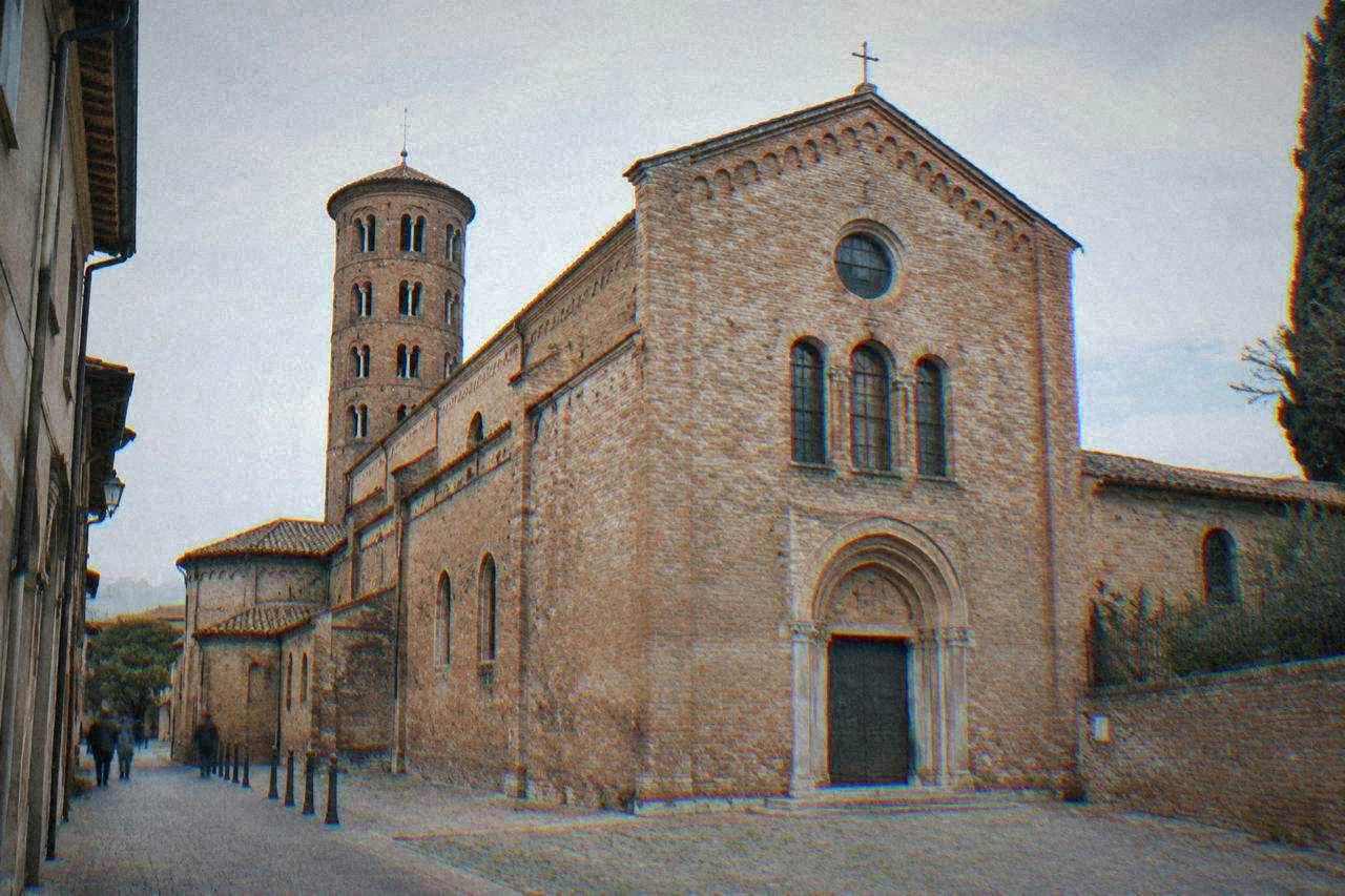 Brick facade of the Basilica of San Francesco in Ravenna on a quiet morning street