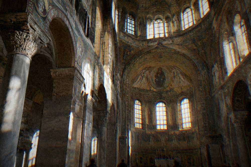 The mosaic vault and clerestory of the Basilica of San Vitale seen from the nave floor