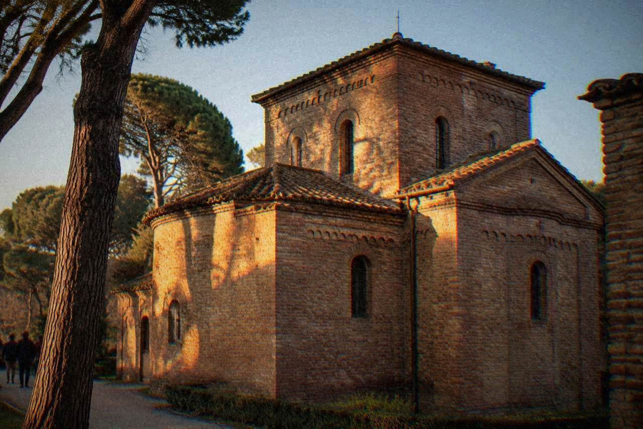 The plain brick exterior of the Mausoleum of Galla Placidia under daylight in Ravenna