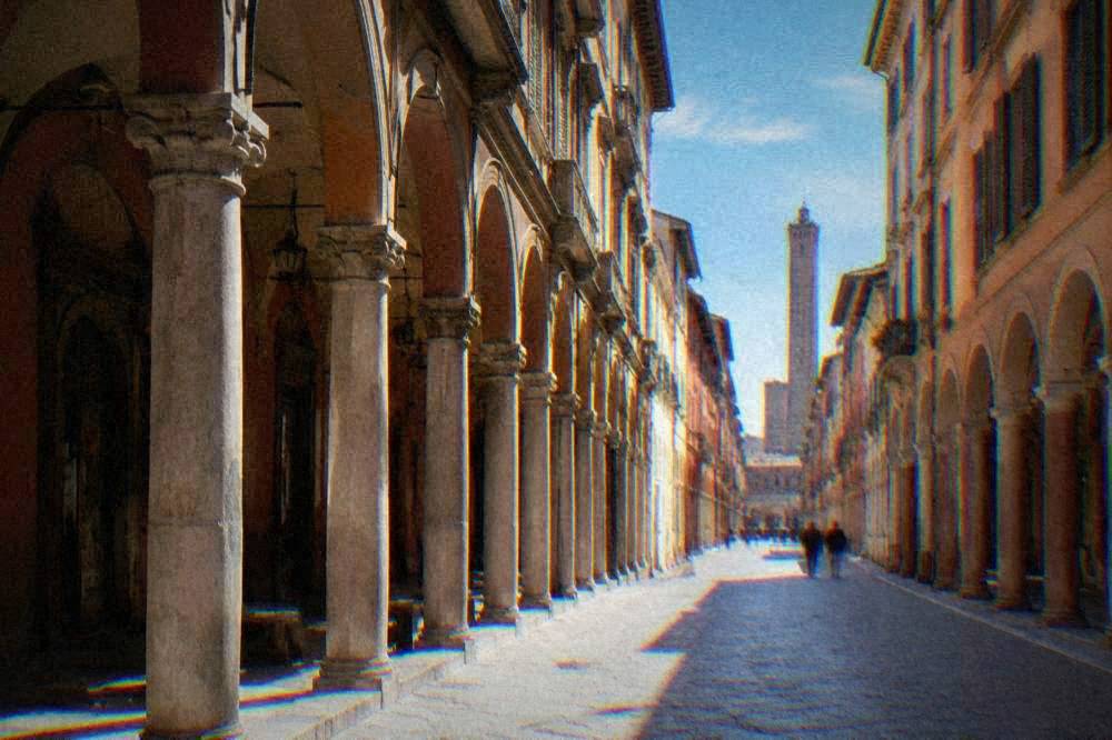 Porticoed street in Bologna with arcades along both sides