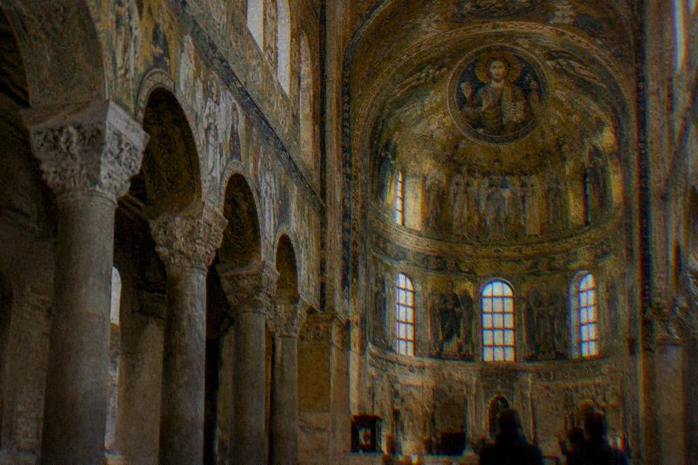 Golden mosaics inside a Ravenna church interior