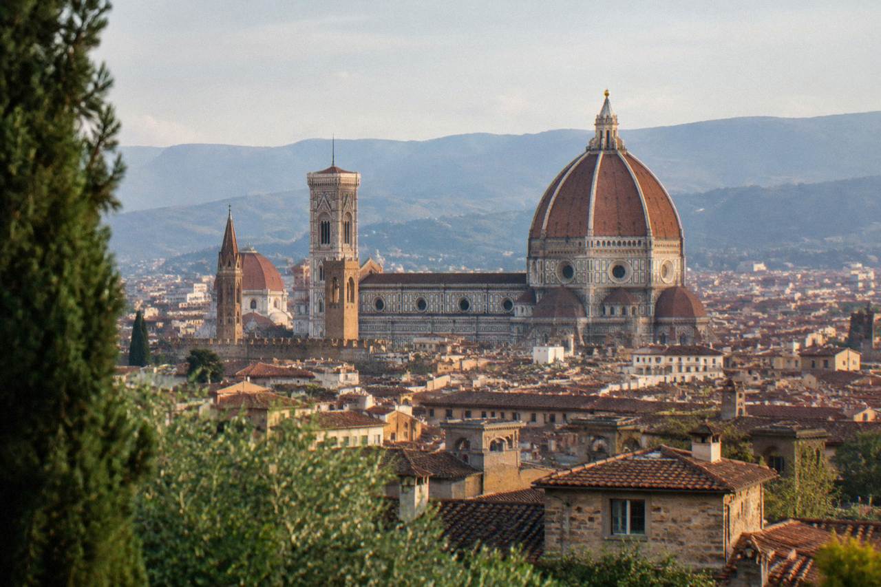 The dome of Florence cathedral rising above the rooftops of the historic city centre