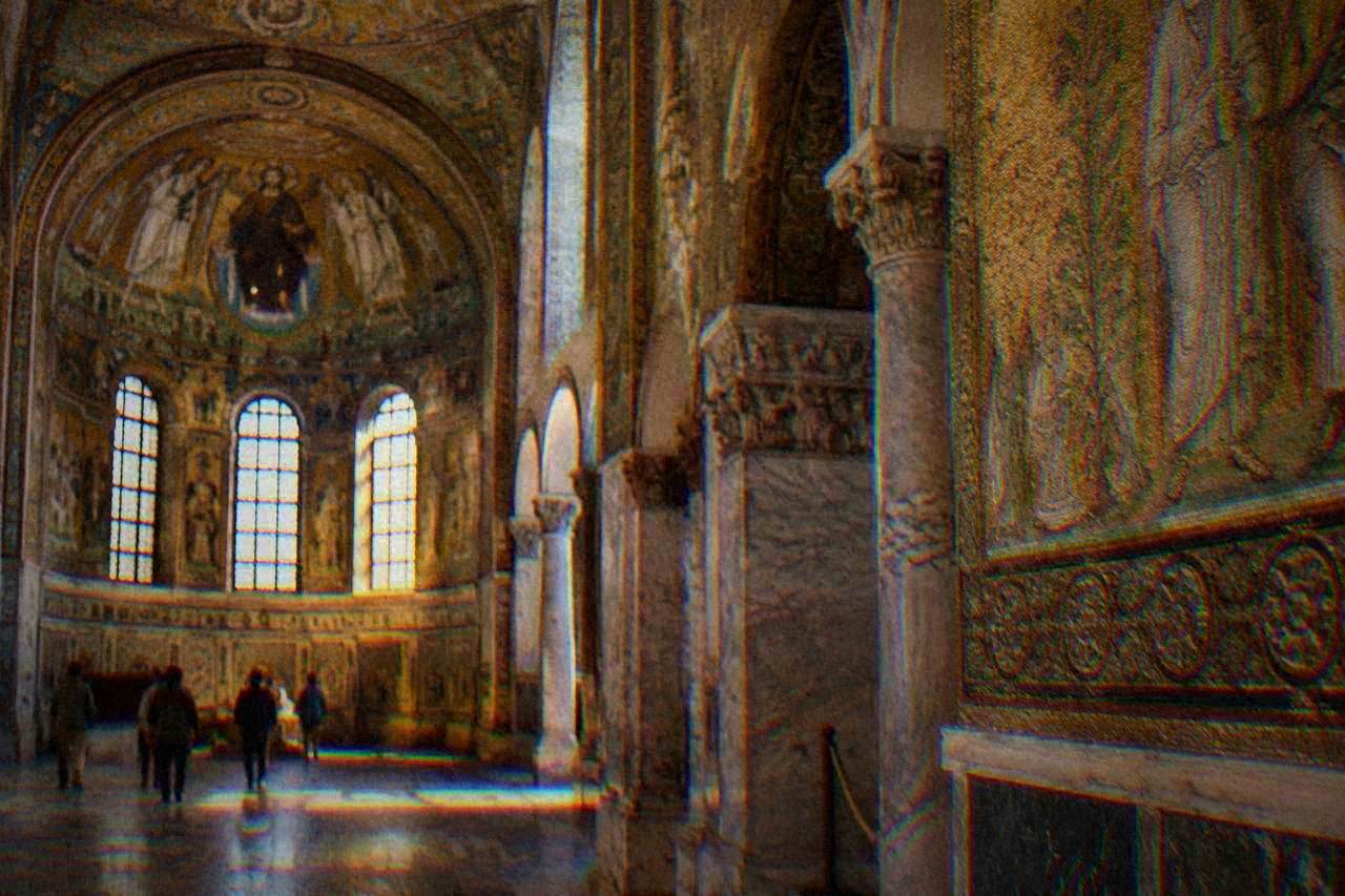 Golden mosaic interior of an early Christian monument in Ravenna lit by soft daylight