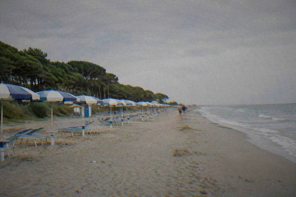 Umbrellas and sand at a beach resort on the Ravenna coast