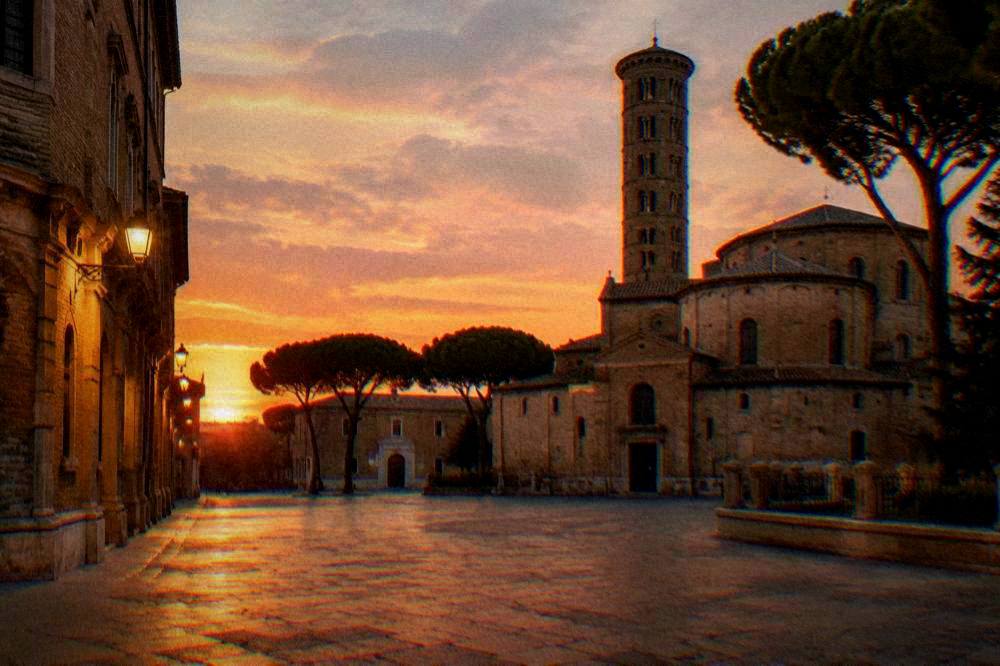 An empty illuminated square in Ravenna on a warm evening