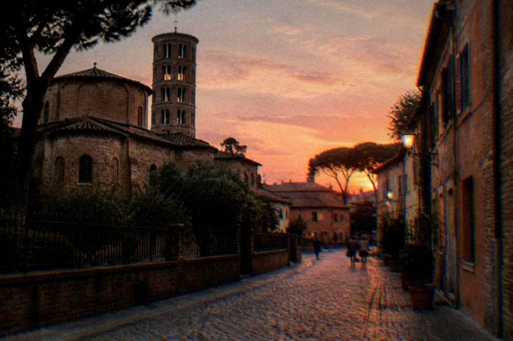 Cobblestone street in an old Italian town under soft evening light