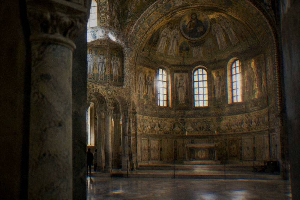 The interior of San Vitale in Ravenna with its mosaic sanctuary glowing under natural light