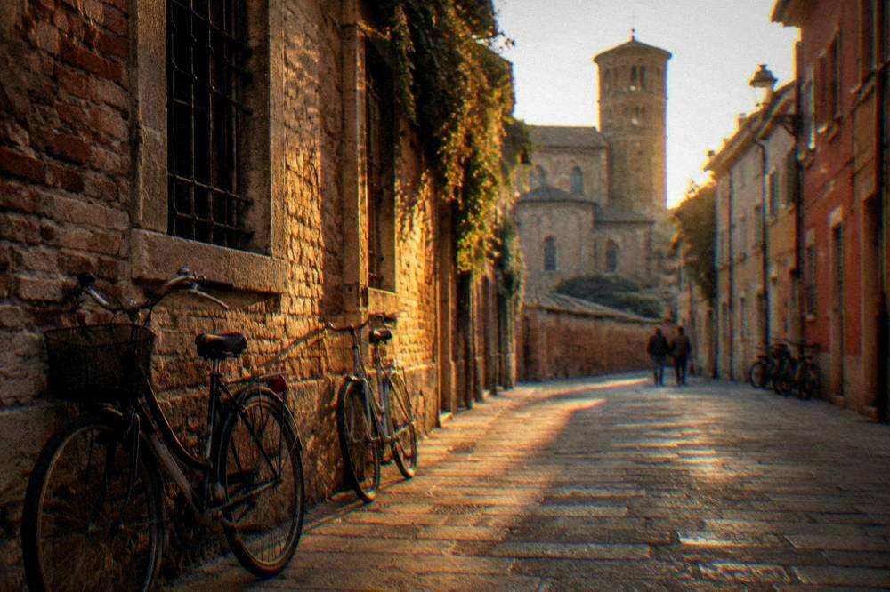 A quiet side street of Ravenna's historic centre with bicycles leaning against a wall