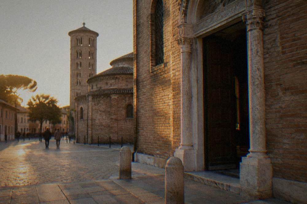 A crowd watching a film screening inside a stone former church venue