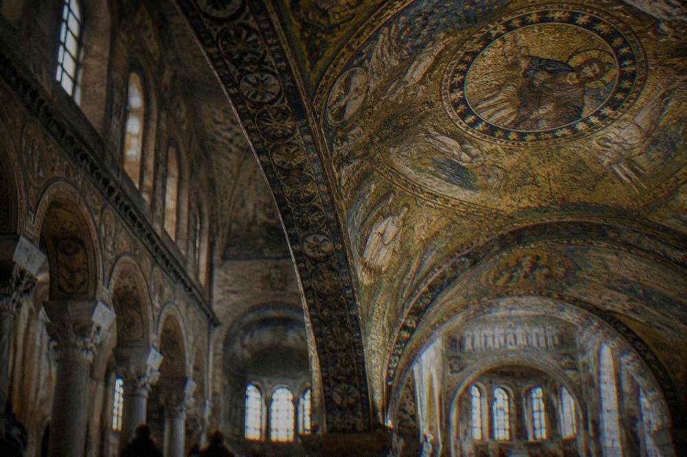 Golden Byzantine mosaic ceiling detail inside a Ravenna basilica