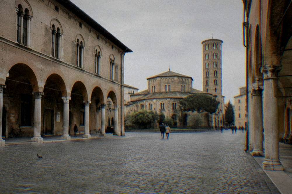A cobbled square with arcaded buildings in the centre of Ravenna