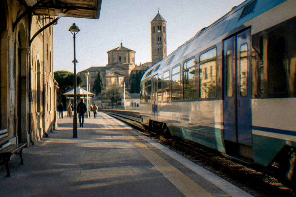 Regional train at a small Italian railway station platform