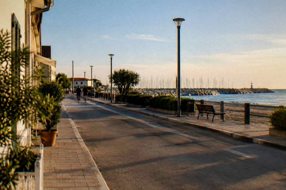 A calm Adriatic beach town street in late afternoon light