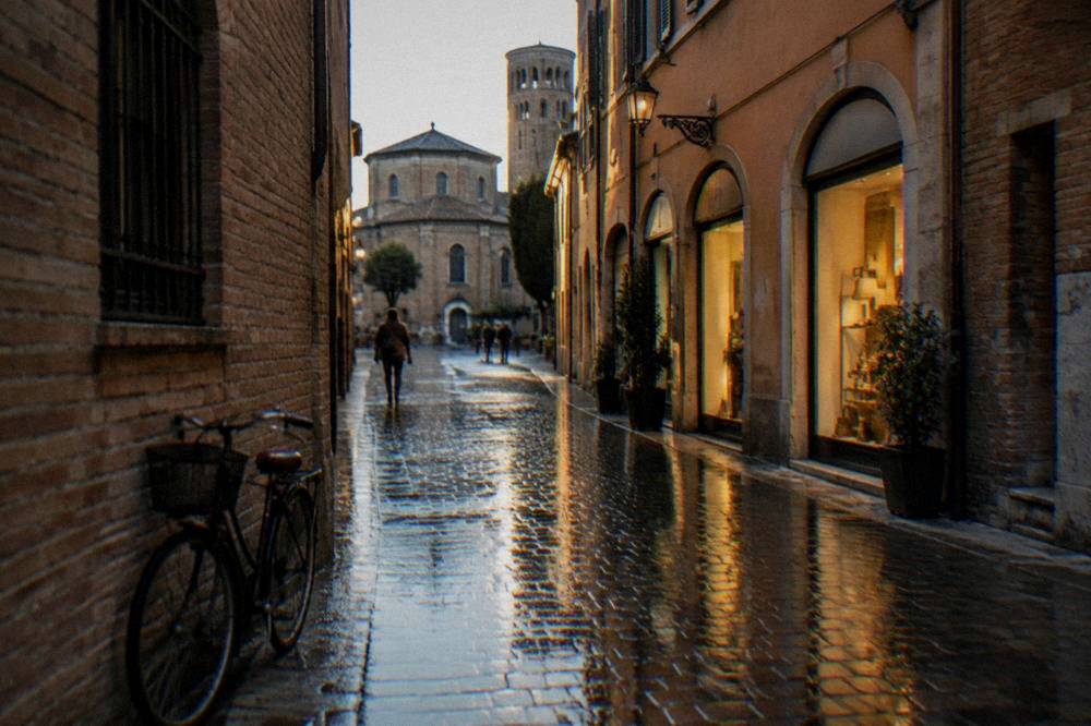The brick exterior of a Byzantine-era monument in Ravenna in late afternoon light