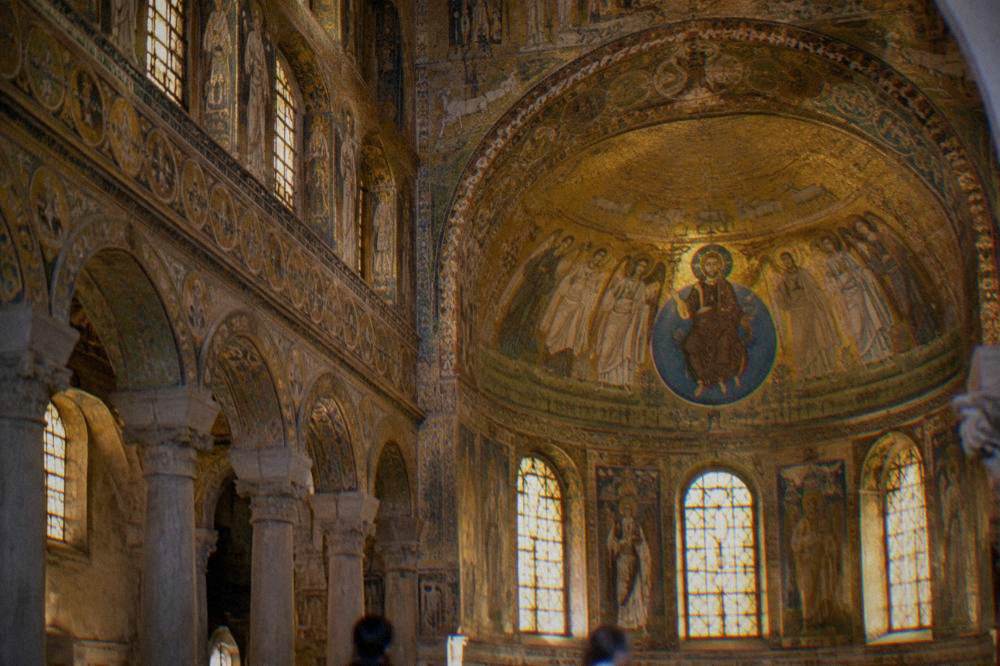 A golden Byzantine mosaic interior glowing inside an early Christian monument