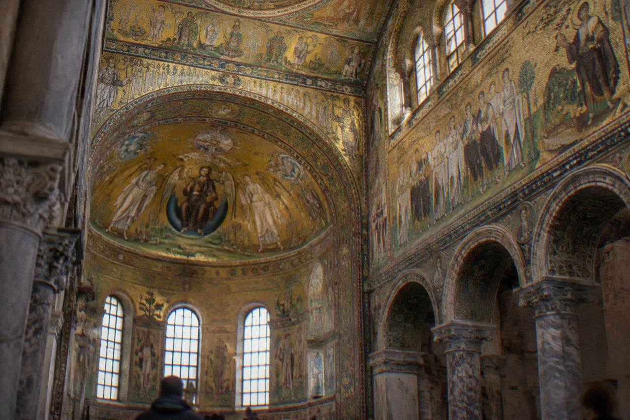 Golden Byzantine mosaics covering the vault and walls of an early Christian monument in Ravenna