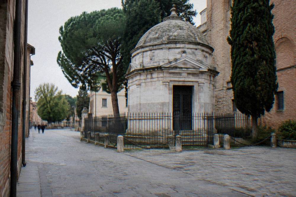 The small stone tomb of Dante beside a quiet street in Ravenna