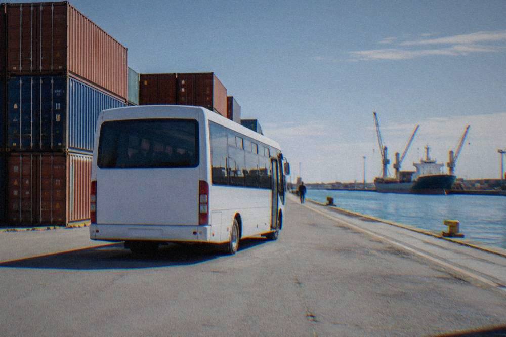 Shuttle bus parked on a quiet street near Ravenna railway station