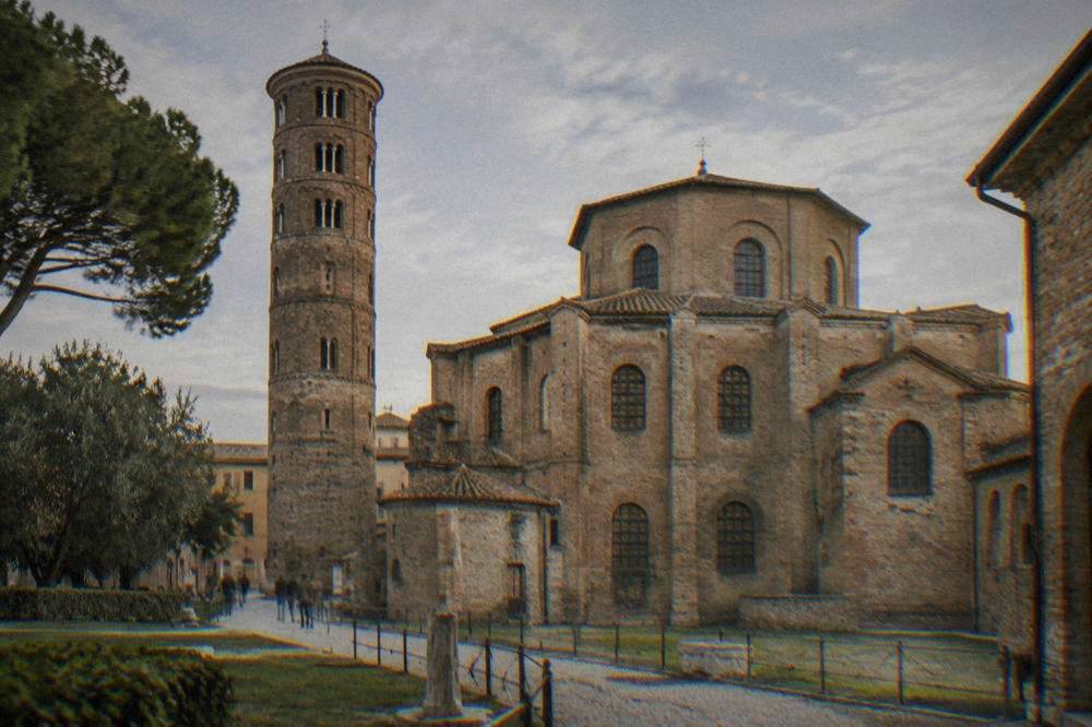 Nave of a Ravenna basilica with rows of mosaic figures along the upper wall