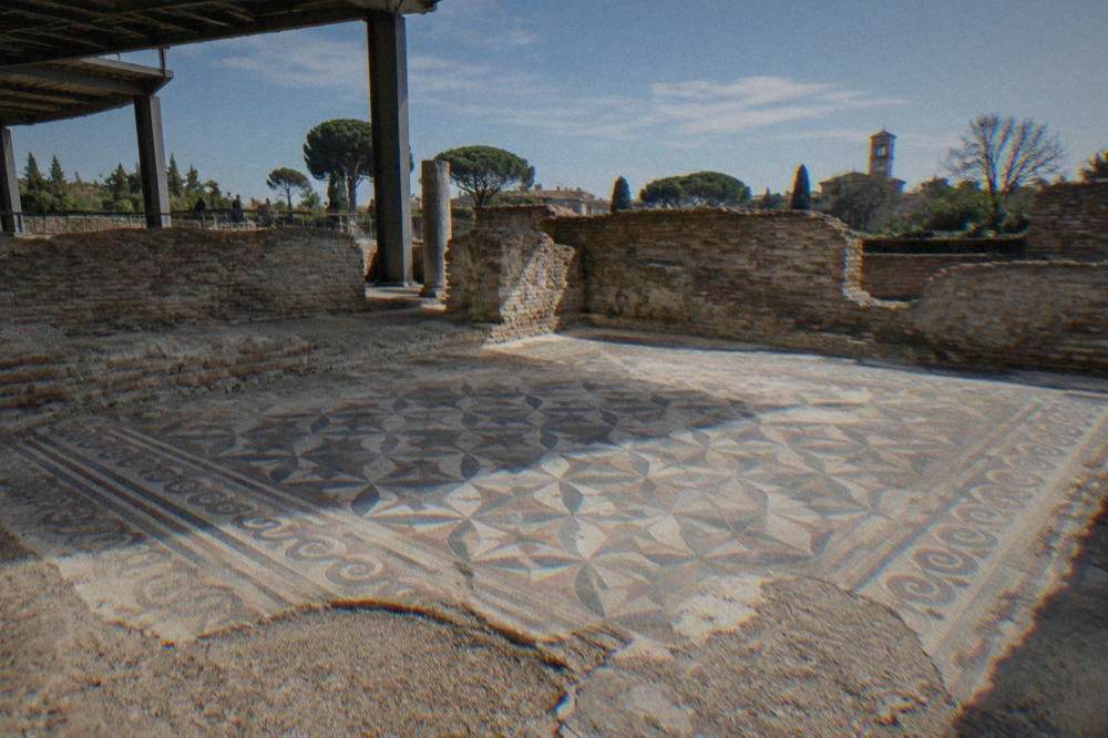 A floor mosaic with geometric patterns inside an excavated Roman domus in Ravenna